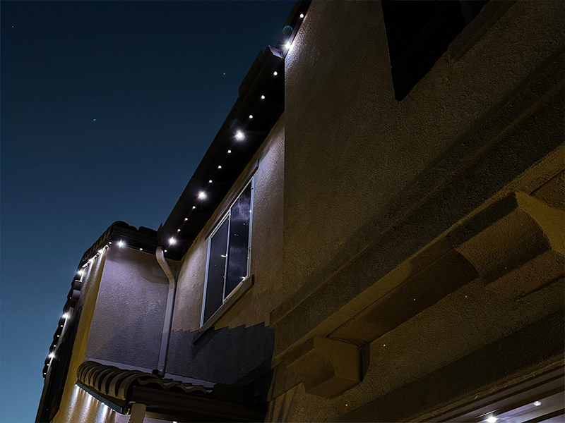 Roofline permanent lighting in a custom white spacing pattern